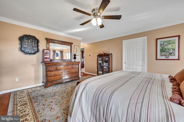 bedroom featuring hardwood / wood-style flooring, ceiling fan, and crown molding