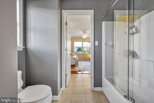 bathroom with tile patterned floors, ceiling fan, enclosed tub / shower combo, and toilet