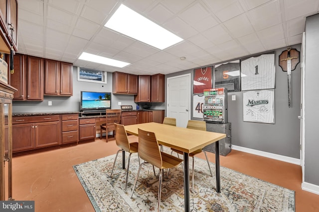 dining space featuring a paneled ceiling