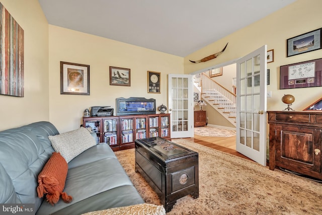 living room with french doors and light hardwood / wood-style floors