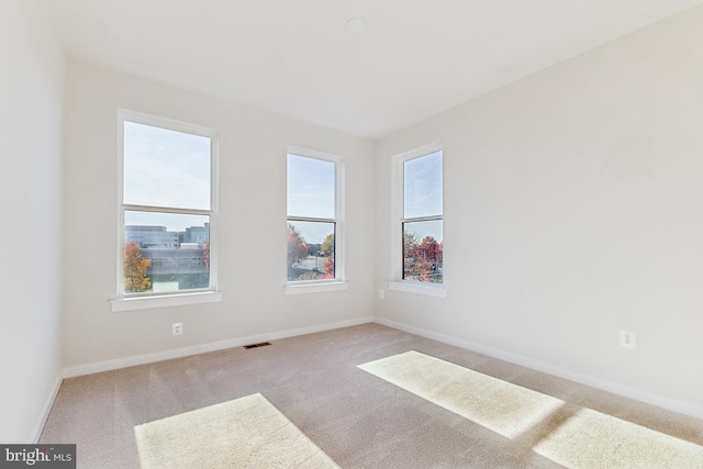 empty room with light colored carpet