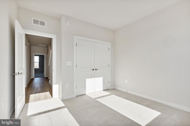 bedroom featuring light colored carpet