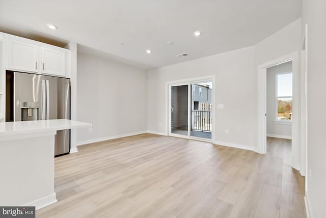 unfurnished living room with light hardwood / wood-style floors