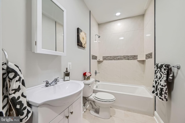 full bathroom with tile patterned flooring, tiled shower / bath combo, toilet, and vanity