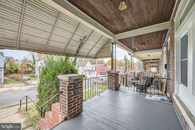 wooden terrace with a porch