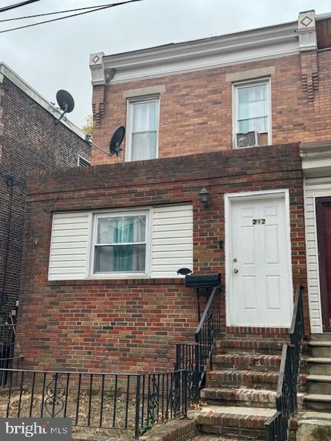 view of front of home featuring cooling unit