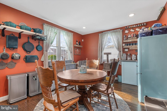 dining space featuring dark wood-type flooring