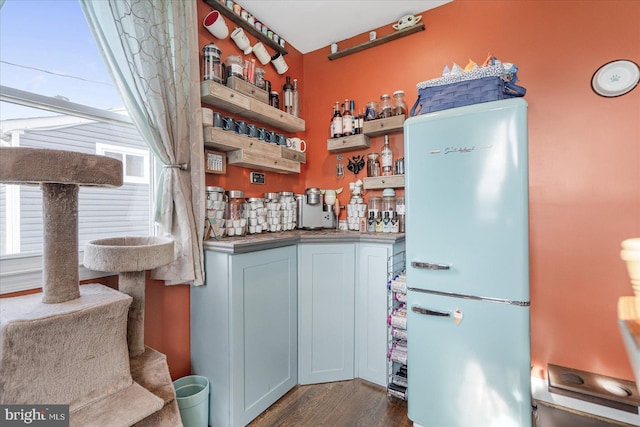 interior space with white refrigerator and dark hardwood / wood-style floors