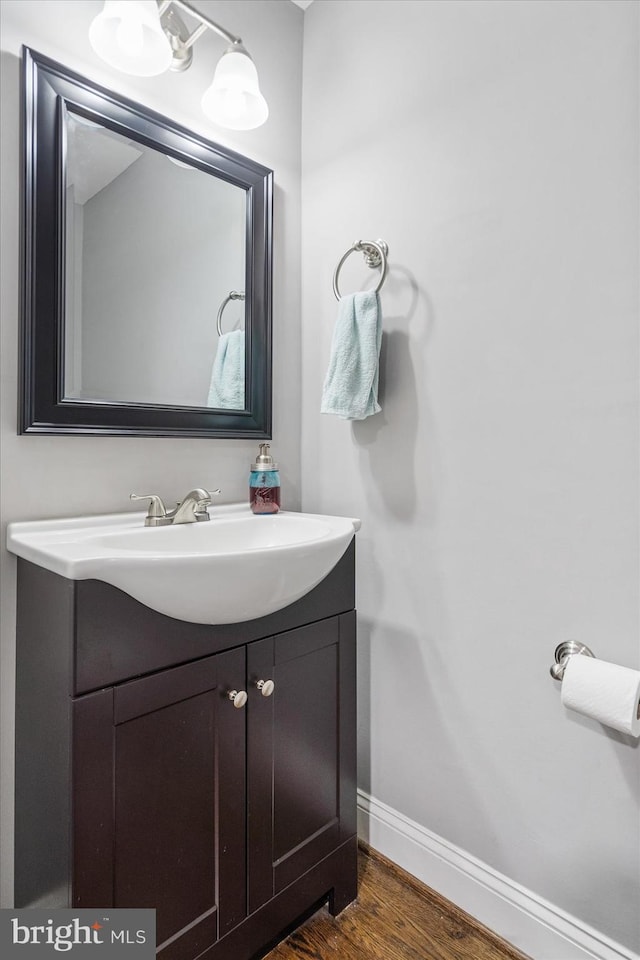 bathroom with vanity and wood-type flooring