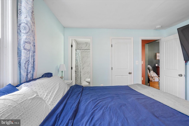 bedroom featuring ensuite bath