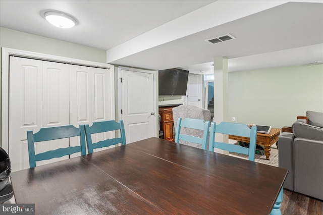 dining space featuring dark hardwood / wood-style flooring