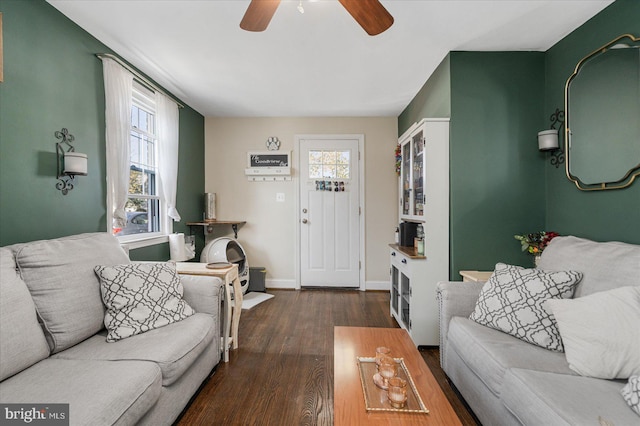 living room featuring dark hardwood / wood-style floors and ceiling fan