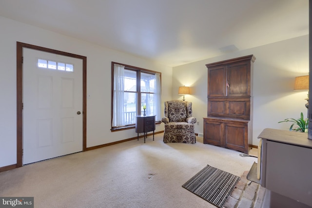 entrance foyer with light colored carpet