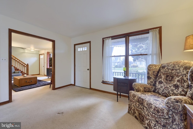 sitting room with light colored carpet