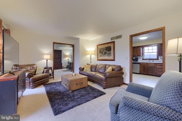 living room featuring light carpet