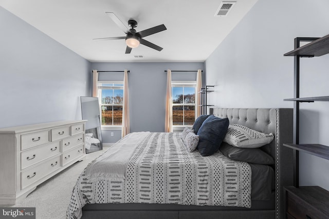 bedroom with ceiling fan and carpet floors