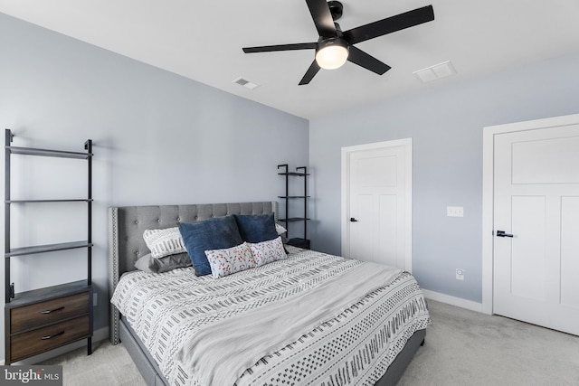 bedroom featuring ceiling fan and light carpet