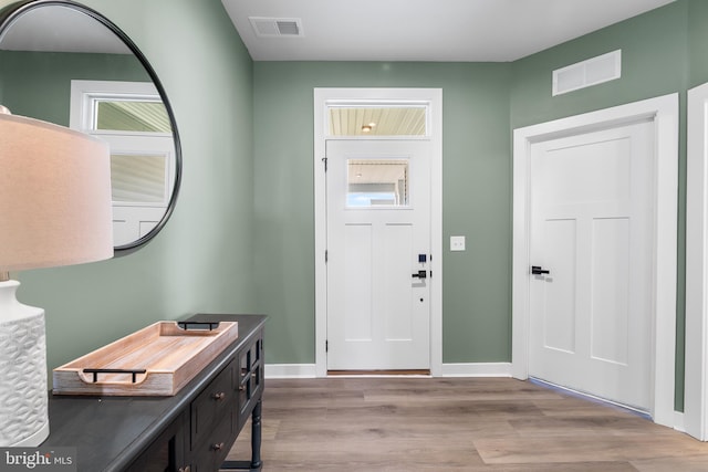 foyer entrance with light hardwood / wood-style flooring