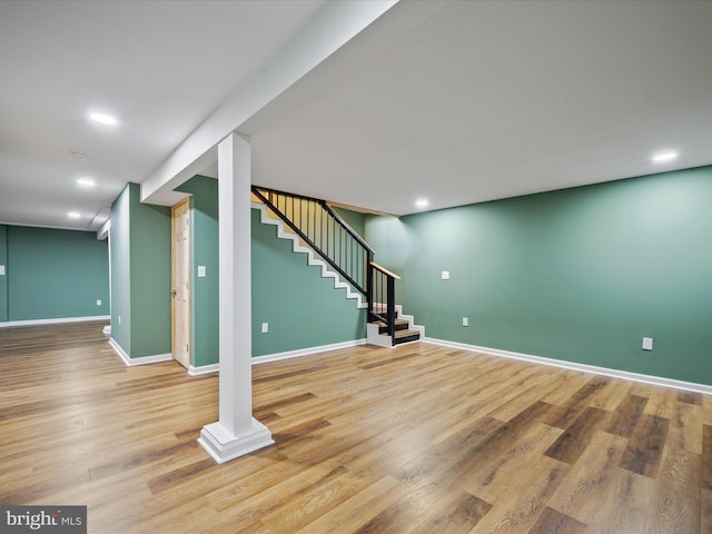 basement with hardwood / wood-style floors