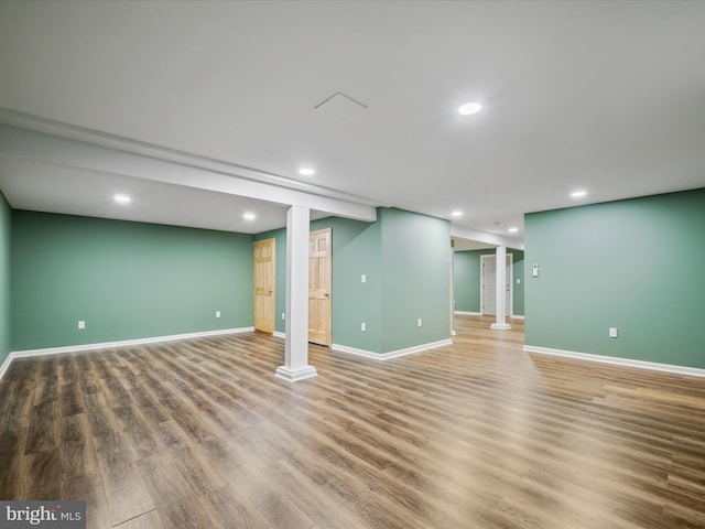 basement featuring hardwood / wood-style floors