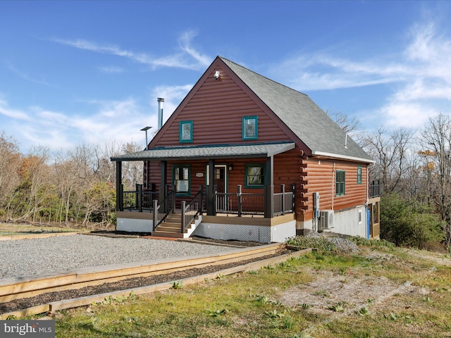 log cabin featuring a porch