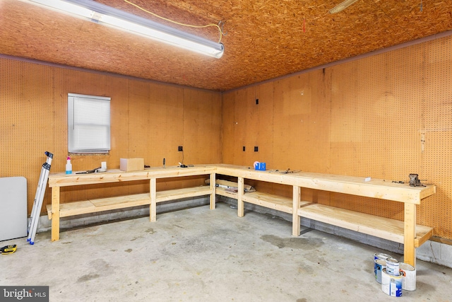 misc room featuring a workshop area and concrete flooring