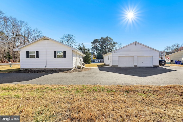 view of side of property with a yard