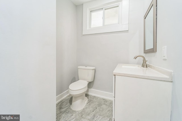 829 Chauncey Ave, Baltimore, MD 21217 - half bathroom with toilet, vanity, and baseboards