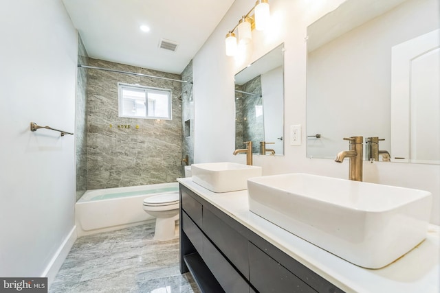 829 Chauncey Ave, Baltimore, MD 21217 - bathroom featuring bathing tub / shower combination, toilet, double vanity, and baseboards