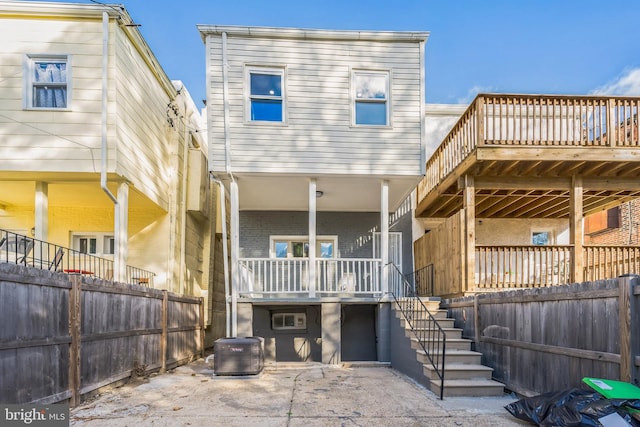 829 Chauncey Ave, Baltimore, MD 21217 - rear view of property featuring stairway and brick siding