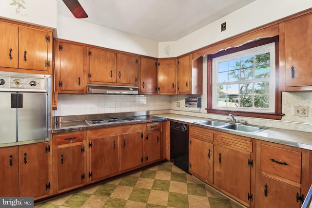 kitchen featuring appliances with stainless steel finishes, decorative backsplash, and sink