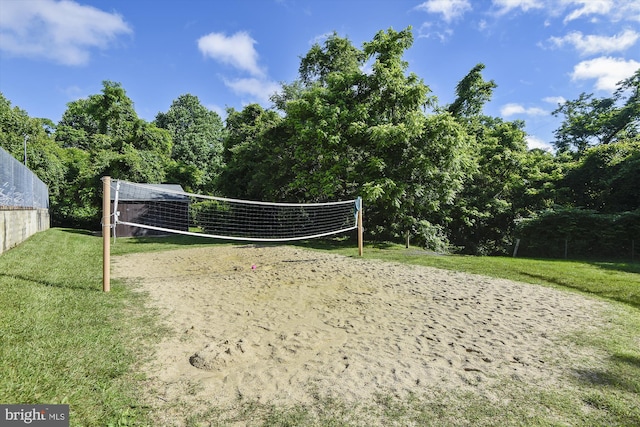 view of home's community with a yard and volleyball court