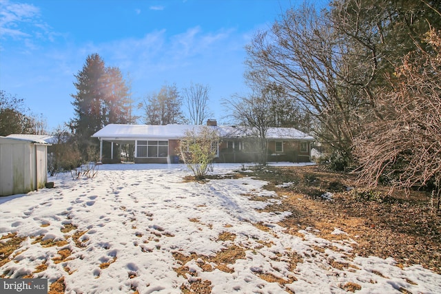 view of snow covered property