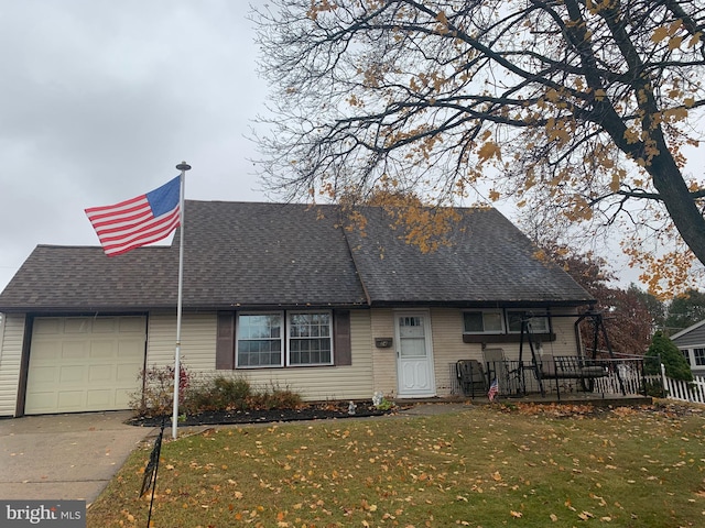 view of front of home featuring a garage and a front yard