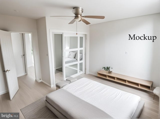 bedroom with ceiling fan and light wood-type flooring