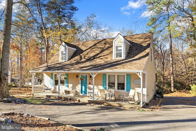 cape cod house with a porch