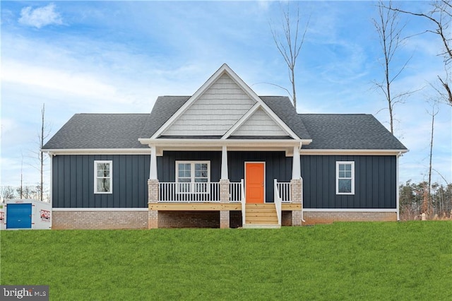 view of front of house featuring a porch and a front lawn