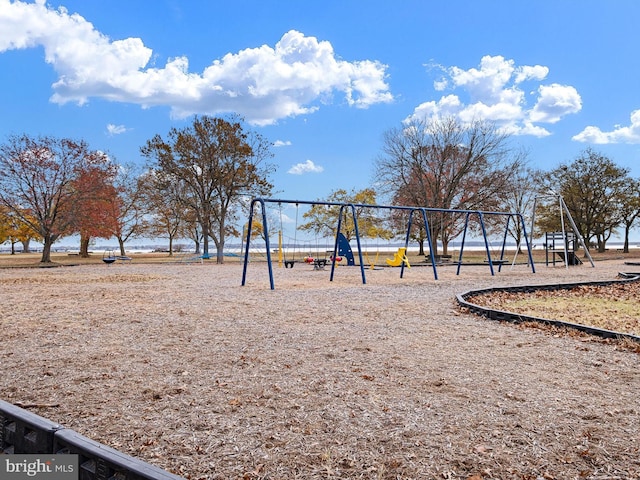 view of playground with a water view