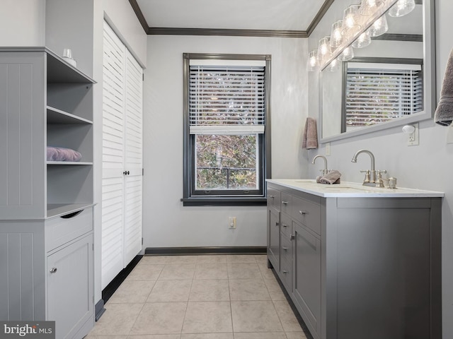 bathroom featuring crown molding, tile patterned flooring, and vanity