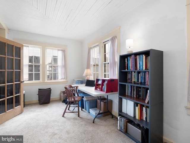 carpeted home office with wooden ceiling