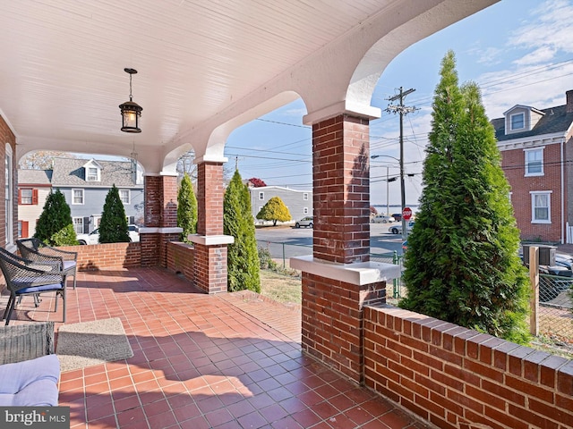 view of patio featuring a porch