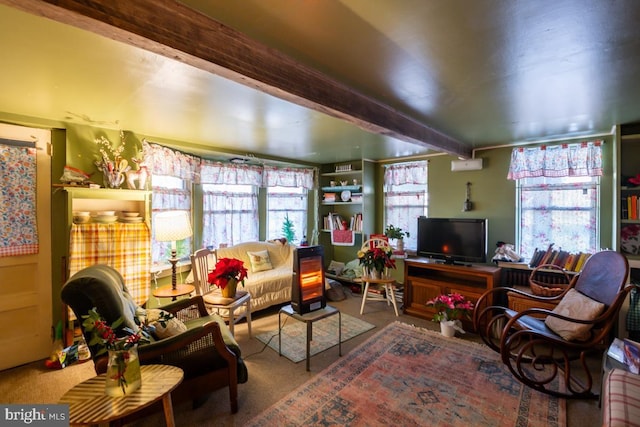 carpeted living room featuring beamed ceiling and a wealth of natural light