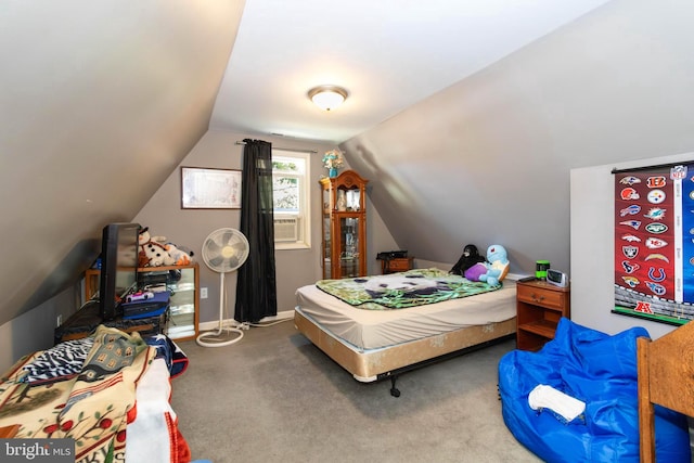 bedroom featuring carpet and lofted ceiling