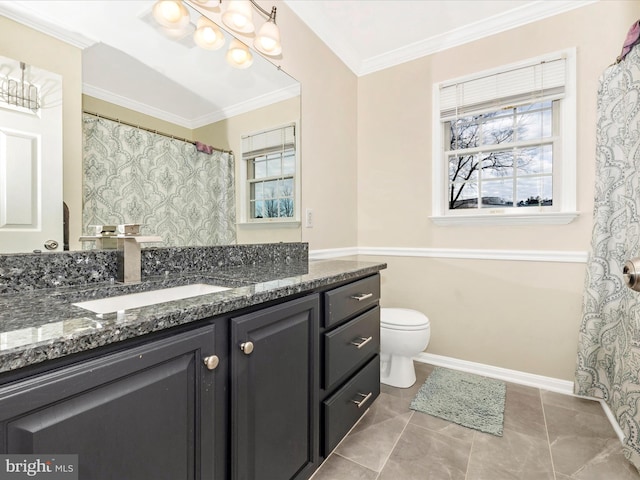 bathroom with vanity, crown molding, tile patterned floors, and toilet