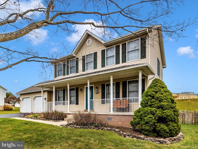 view of front facade featuring a garage, a porch, and a front lawn