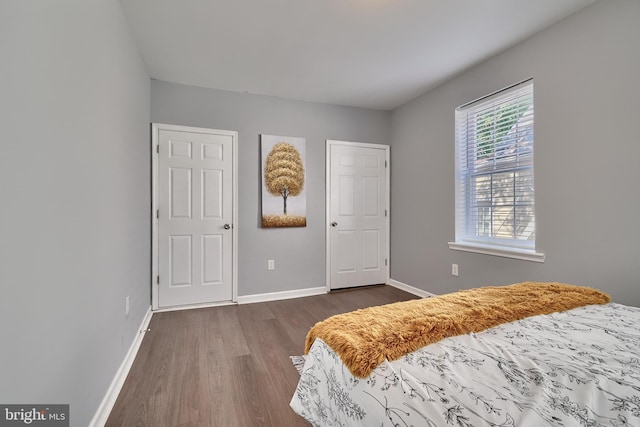 bedroom featuring dark wood-type flooring