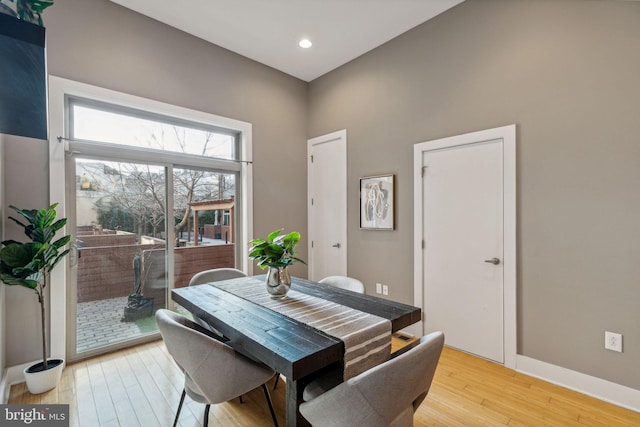 dining space with light hardwood / wood-style floors