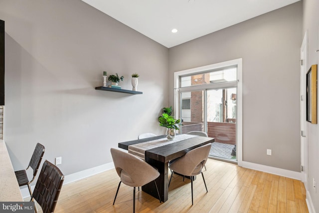 dining area with light hardwood / wood-style flooring