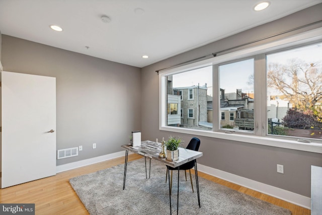 office space with light wood-type flooring