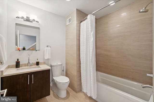 full bathroom with toilet, vanity, and shower / tub combo with curtain